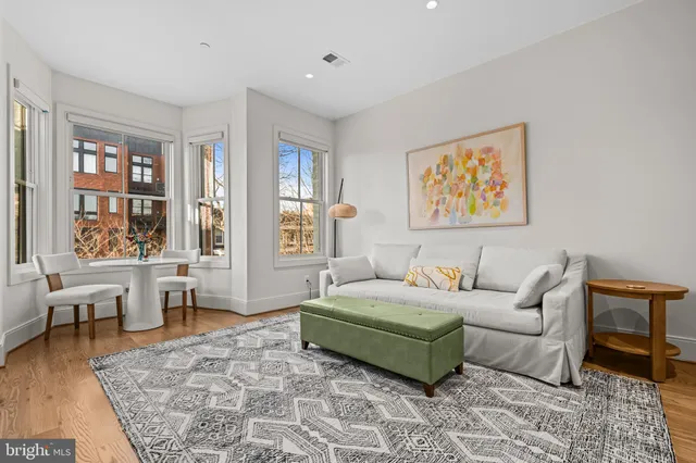 a living room with furniture and a rug