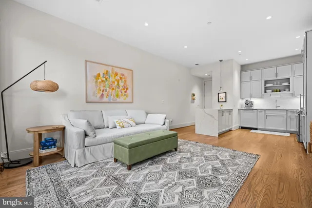 a living room with furniture and a rug