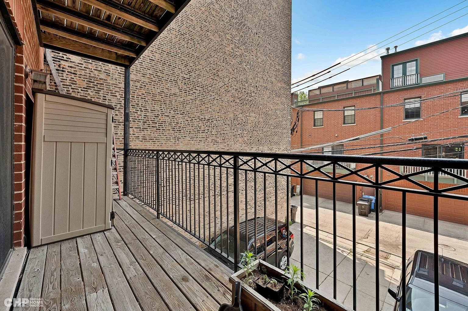 1035 West Madison Street, Unit 2 Chicago, IL 60607 - Photo 11 of 17 a view of a balcony with wooden floor