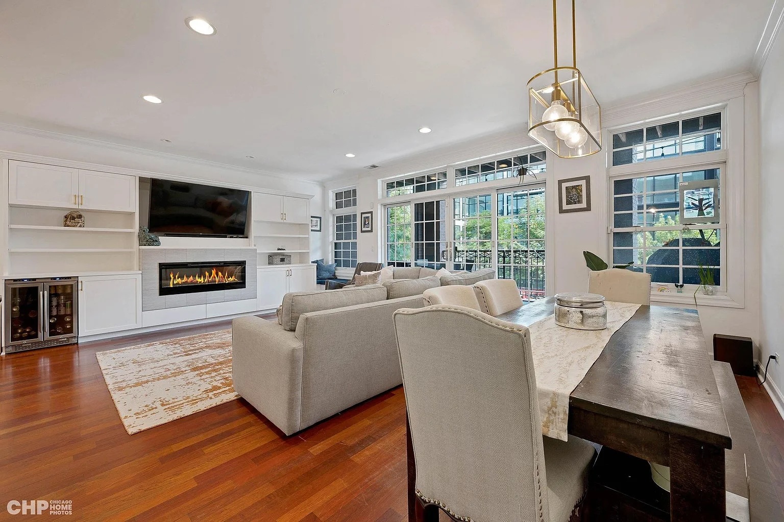 1035 West Madison Street, Unit 2 Chicago, IL 60607 - Photo 5 of 17 a living room with furniture fireplace and a flat screen tv