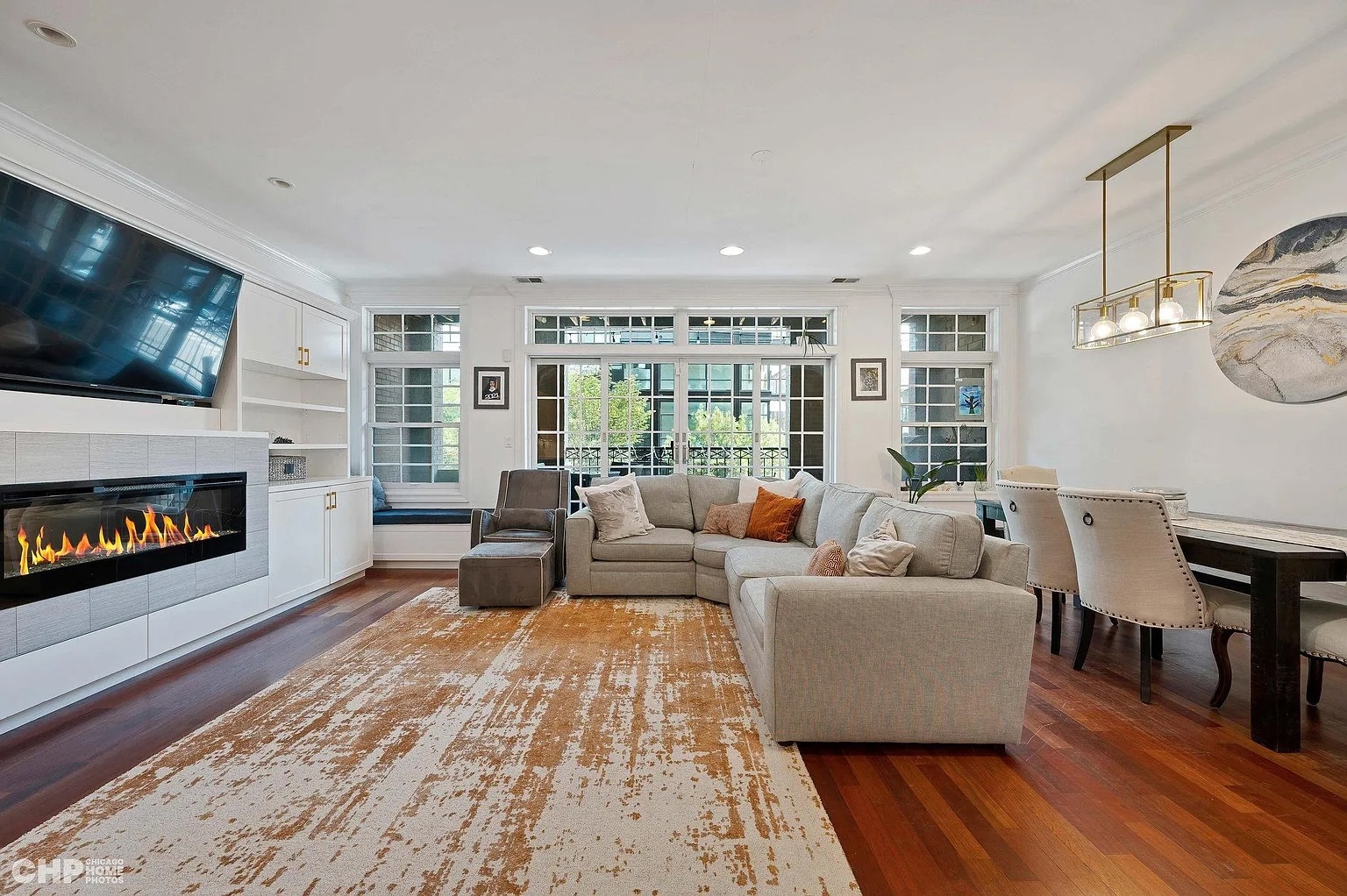 1035 West Madison Street, Unit 2 Chicago, IL 60607 - Photo 7 of 17 a living room with furniture large window and a fireplace