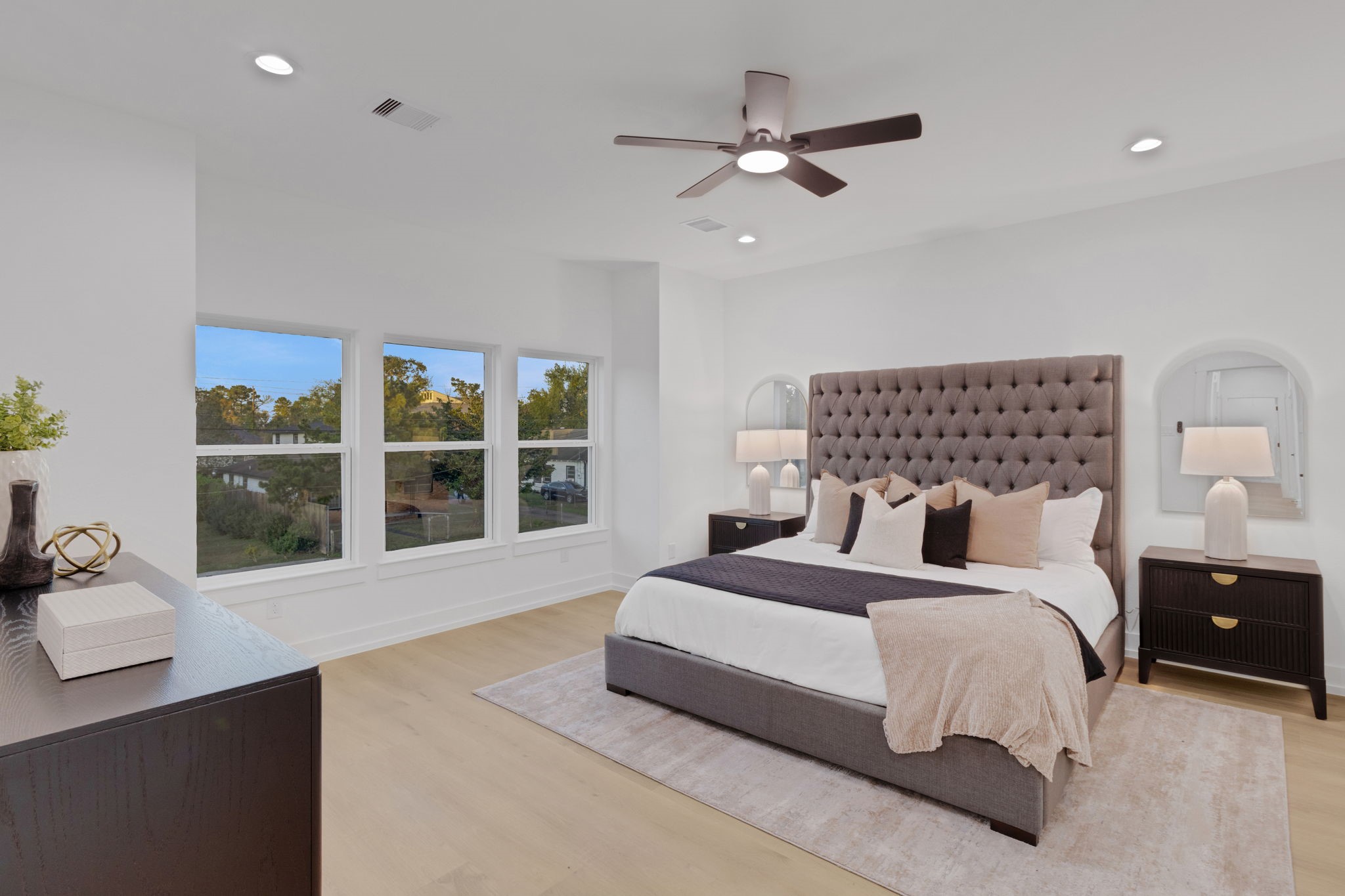 4202 Plaag Street Houston, TX 77016 - Photo 22 of 38 Expansive primary suite with large windows, tray ceiling, and serene views