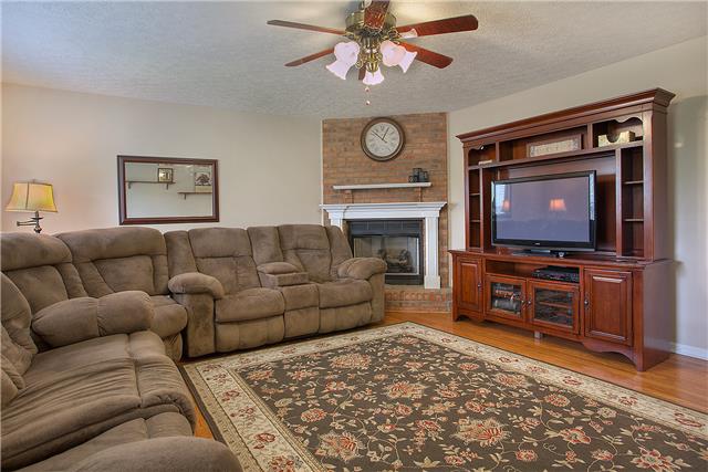 629 Peach Valley Road Gallatin, TN 37066 - Photo 6 of 20 Spacious living room with hardwoods and corner brick fireplace.