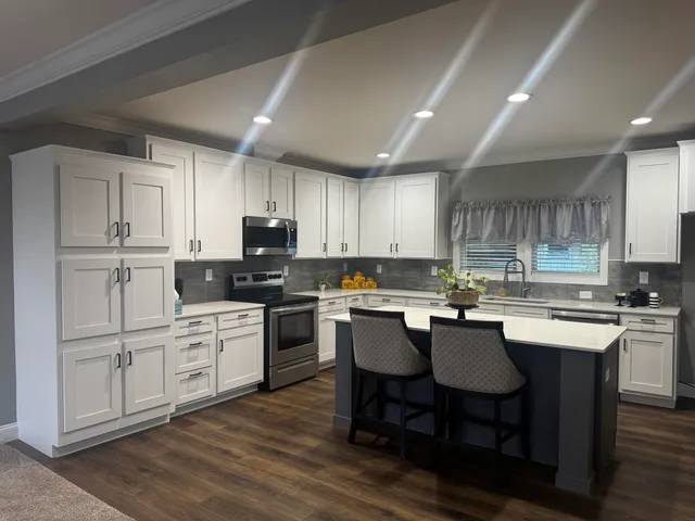 a kitchen with a table and chairs in it