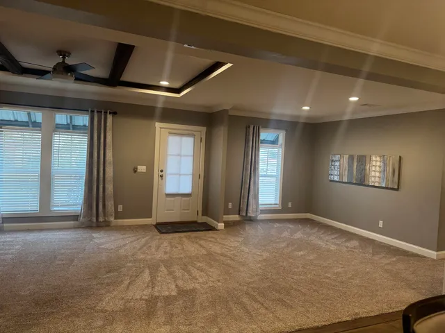 a view of an empty room with a fireplace