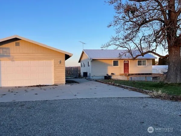 a view of a house with a street