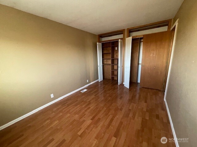64 Lakeview Way Brewster, WA 98812 - Photo 11 of 31 an empty room with wooden floor and entrance