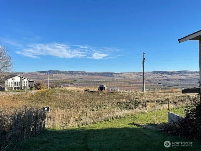 a view of a lake with a yard