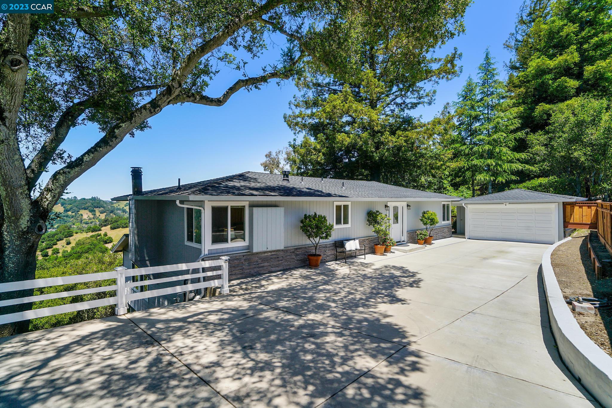 45 El Gavilan Road Orinda, CA 94563 - Photo 1 of 1 a house with trees in the background