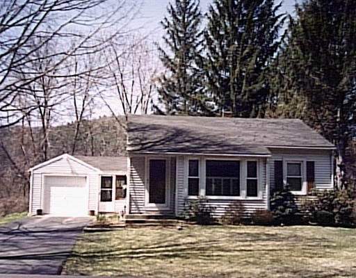 232 Palmer Road Monson, MA 01057 - Photo 1 of 1 a front view of a house with yard