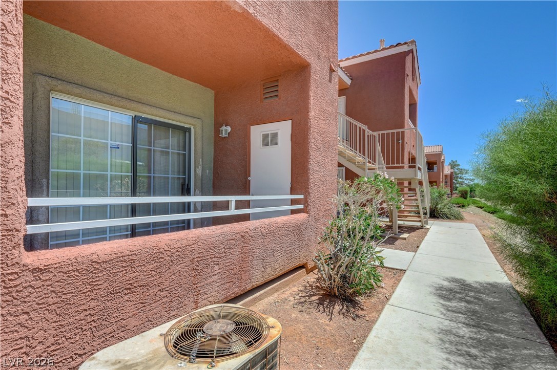 4730 East Craig Road, Unit 1155 Las Vegas, NV 89115 - Photo 3 of 41 An inviting private patio awaits, offering seamless access to an outdoor walkway.