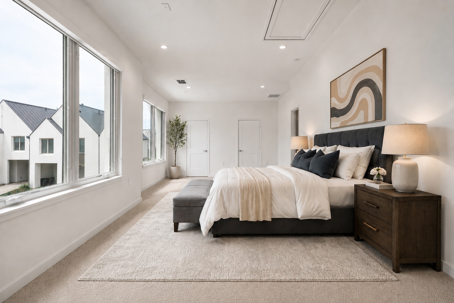 2520 Sutherland Street Austin, TX 78746 - Photo 20 of 26 A tranquil grand sized second primary bedroom suite with ample natural light, featuring plush carpeting and recessed lighting for a calming ambiance.