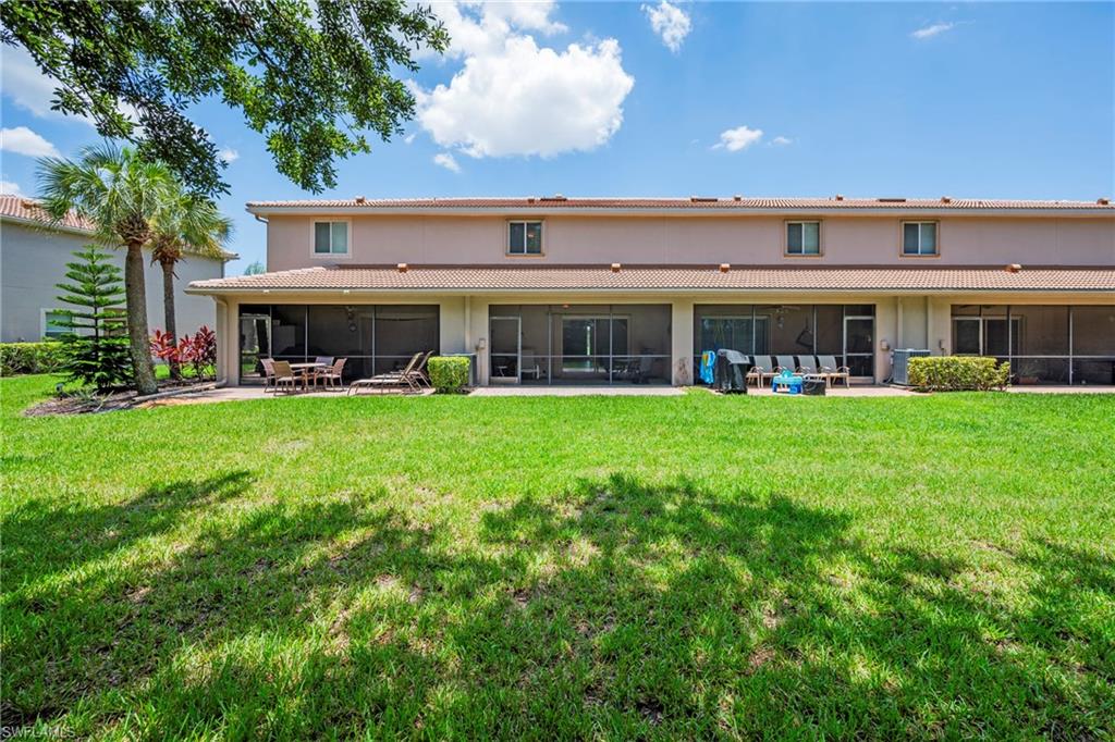 3916 Cherrybrook Loop Fort Myers, FL 33966 - Photo 20 of 31 Expansive green lawn with mature landscaping