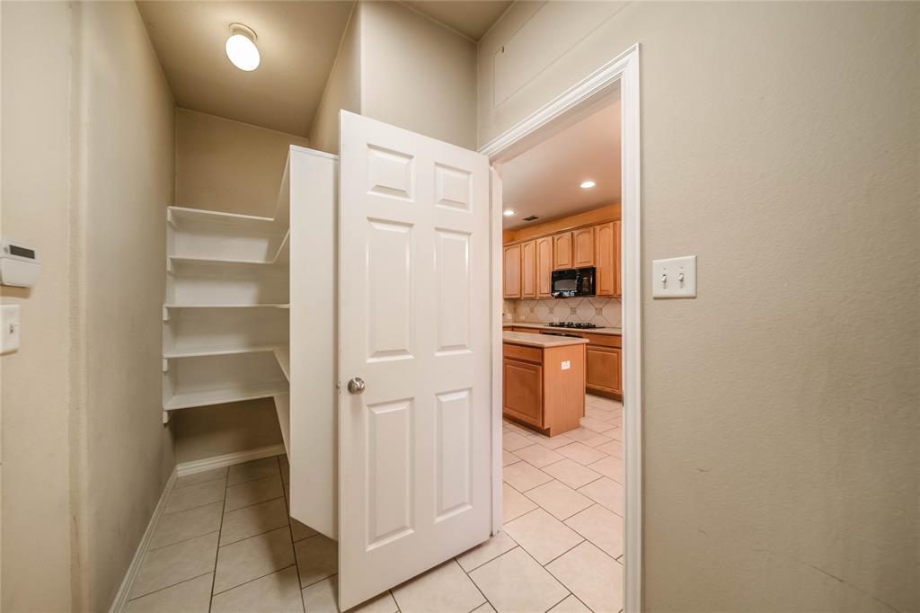 1117 Baylor Road Melissa, TX 75454 - Photo 17 of 40 a kitchen with white cabinets and white appliances