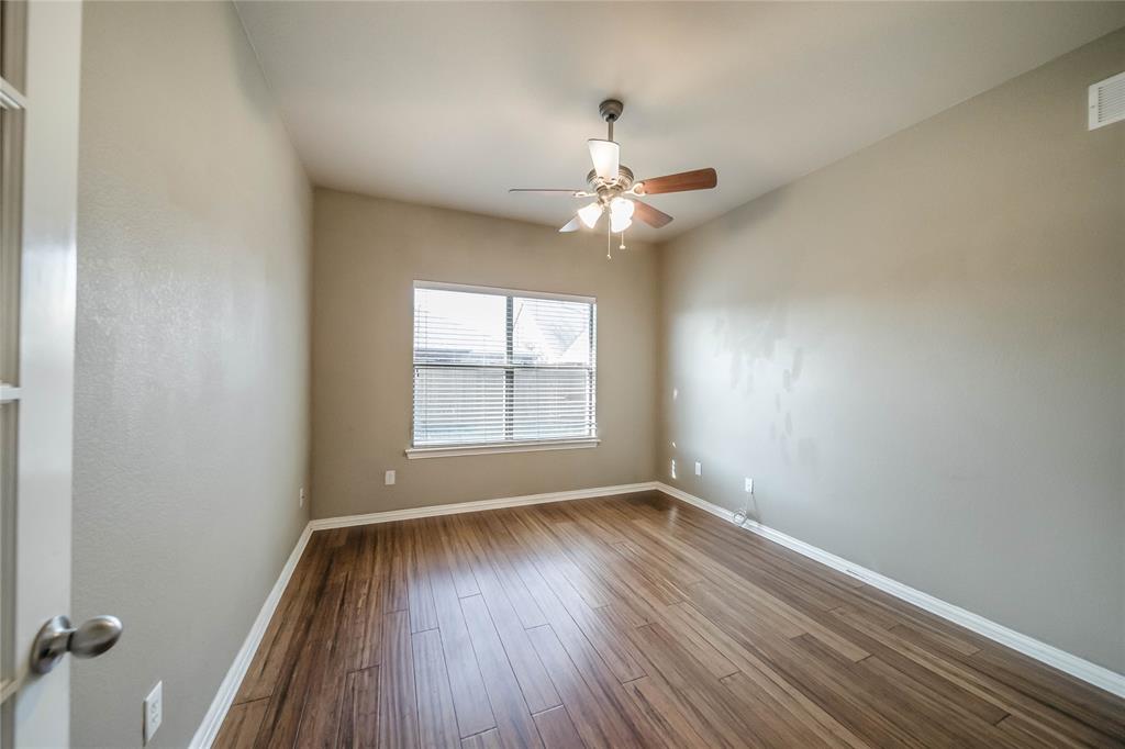 1117 Baylor Road Melissa, TX 75454 - Photo 21 of 40 wooden floor in an empty room with a window