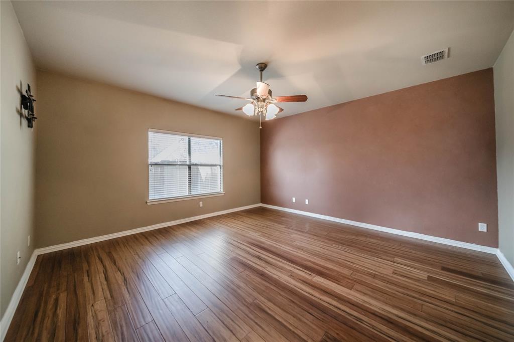 1117 Baylor Road Melissa, TX 75454 - Photo 23 of 40 wooden floor in an empty room with a window