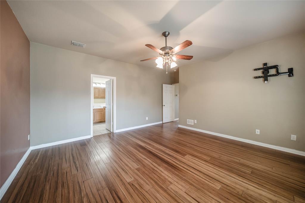1117 Baylor Road Melissa, TX 75454 - Photo 24 of 40 wooden floor in an empty room with a window