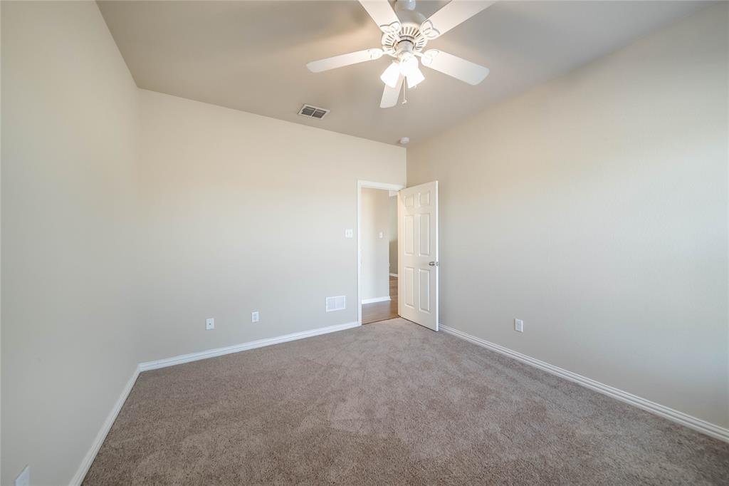 1117 Baylor Road Melissa, TX 75454 - Photo 34 of 40 an empty room with a fan and a fan
