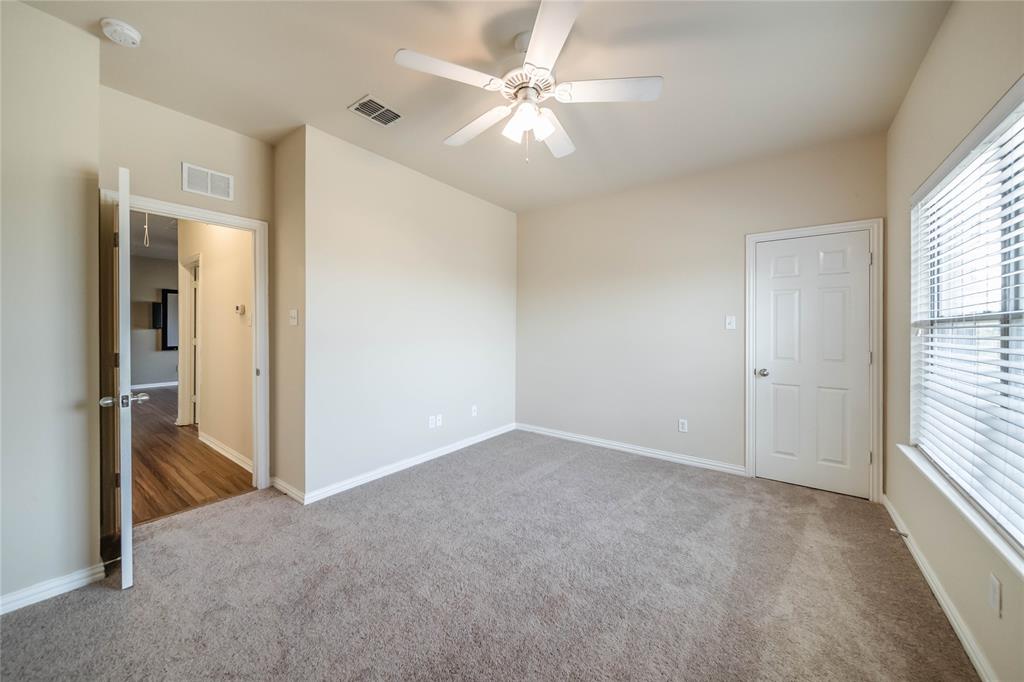 1117 Baylor Road Melissa, TX 75454 - Photo 37 of 40 an empty room with windows and fan