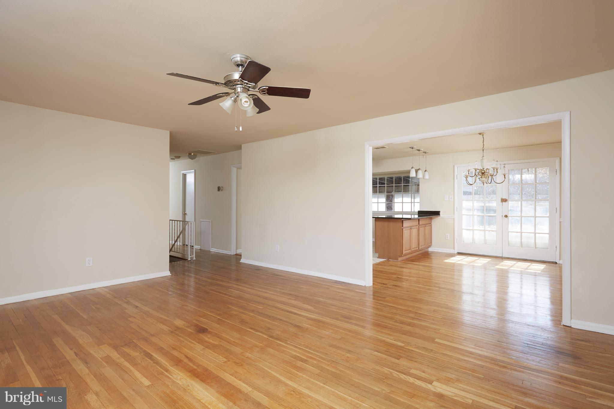 12901 Layhill Road Silver Spring, MD 20906 - Photo 5 of 30 a view of an empty room with window and wooden floor