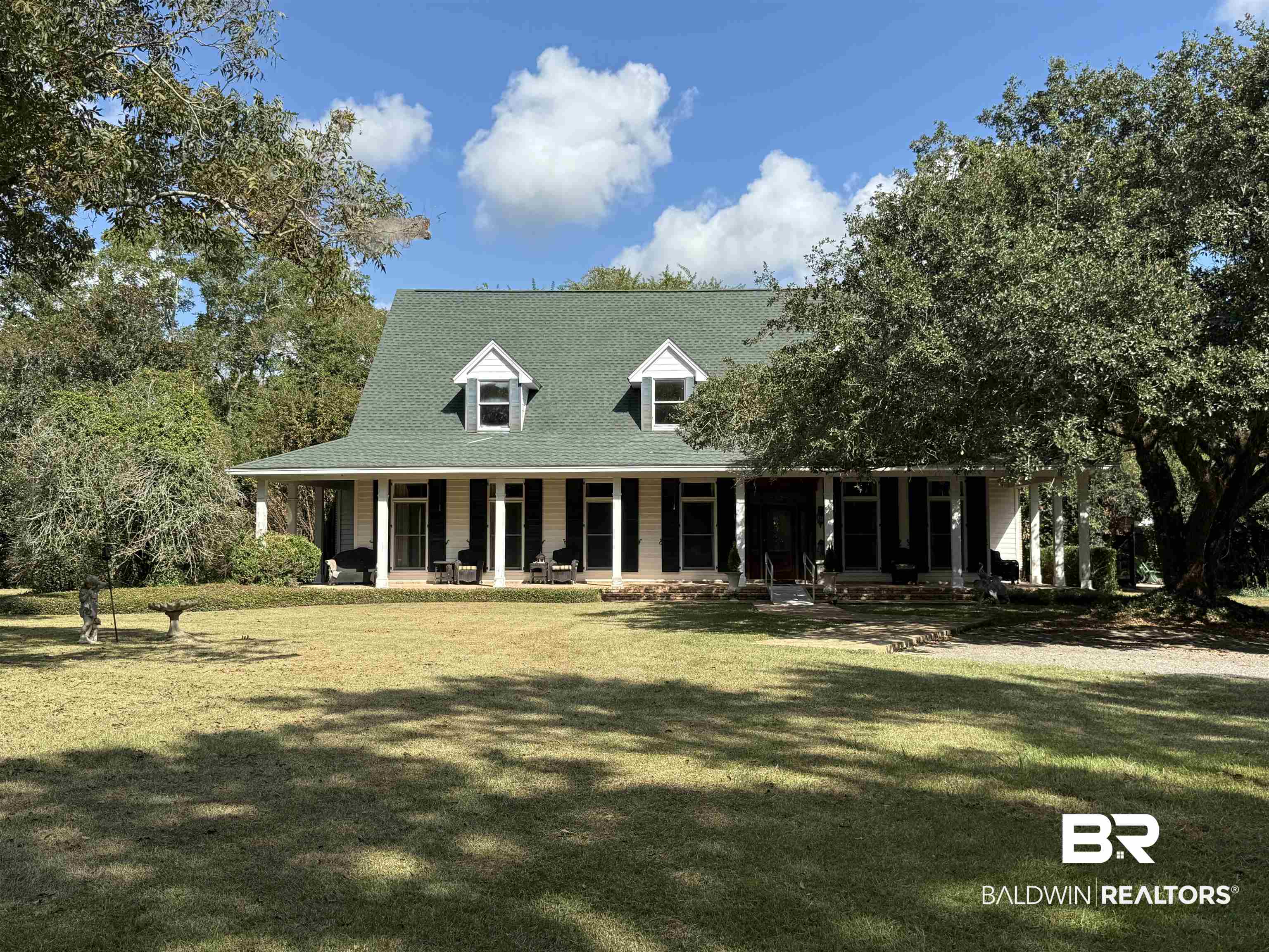 15810 County Road 73 Foley, AL 36535 - Photo 1 of 56 View of front facade featuring a porch and a front yard