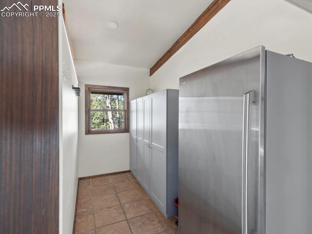 10530 Hungate Road Colorado Springs, CO 80908 - Photo 14 of 42 a view of an empty room with an entryway