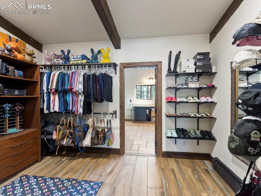 10530 Hungate Road Colorado Springs, CO 80908 - Photo 19 of 42 a view of walk in closet with clothes and shoes