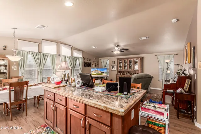 a open kitchen with stainless steel appliances granite countertop a stove and refrigerator