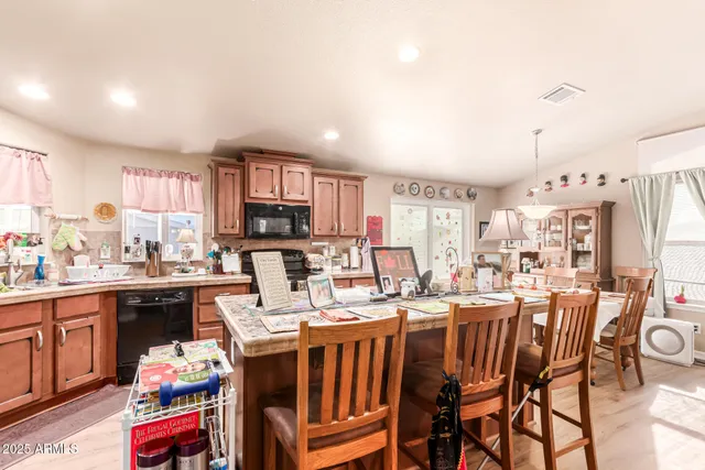 a large kitchen with a table and chairs