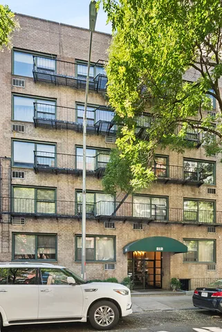 a bathroom with a toilet a sink and shower