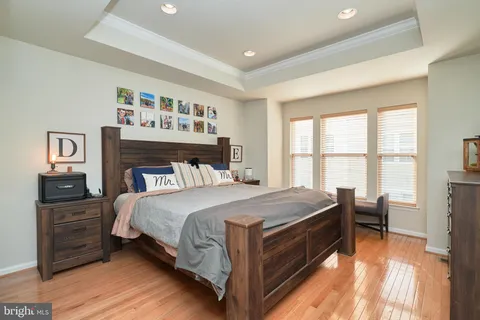 a bed room with a bed and a tv