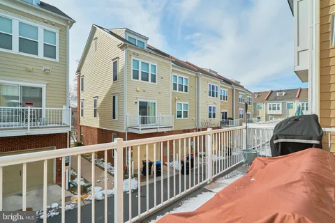 a view of a brick building next to a yard