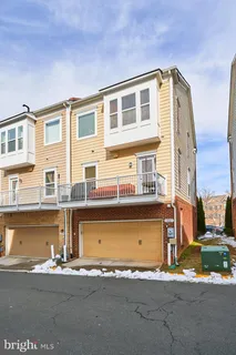 a front view of a house with a road