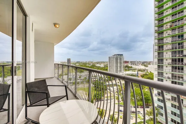 a view of a balcony with chairs