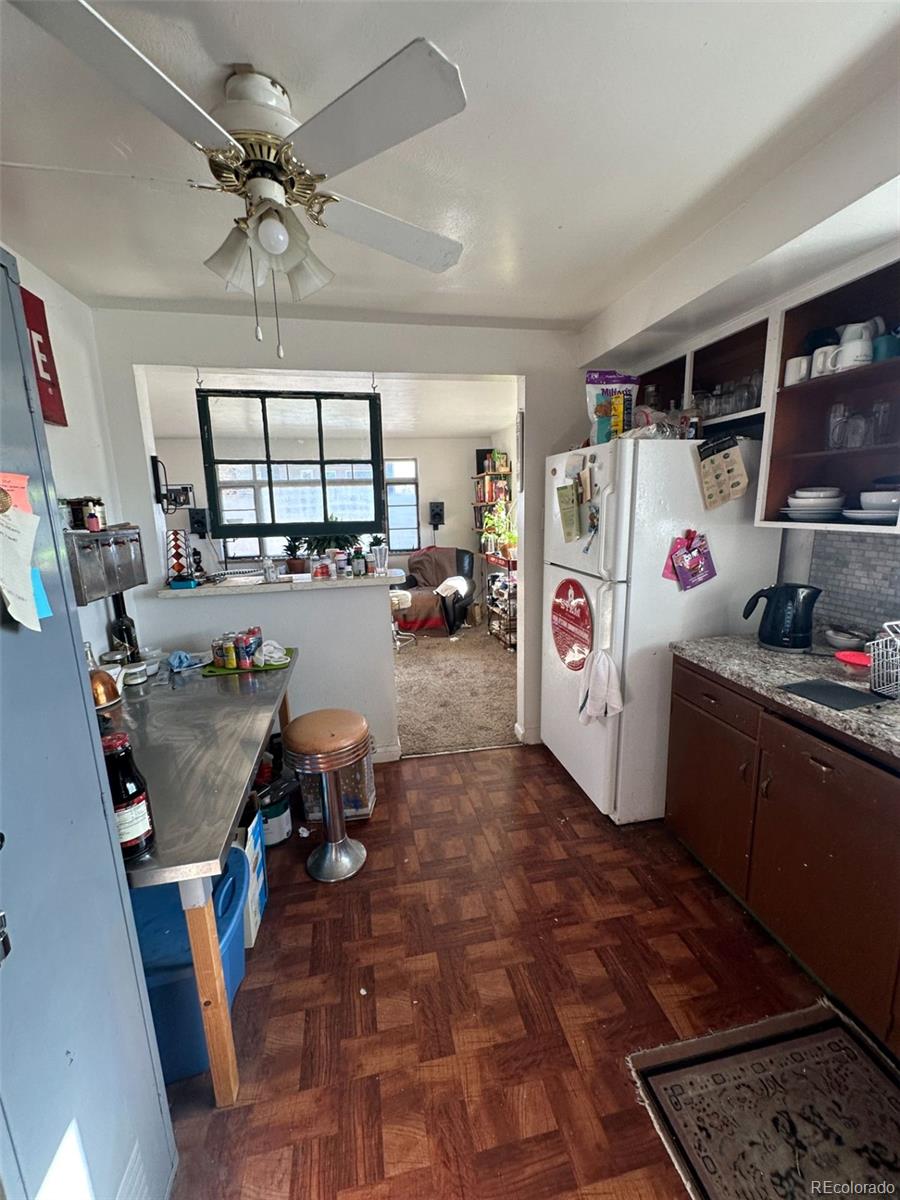 1265 Yates Street Denver, CO 80204 - Photo 3 of 17 a view of a livingroom with furniture and a window
