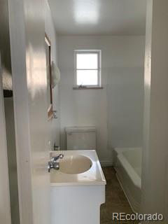 1265 Yates Street Denver, CO 80204 - Photo 10 of 17 a bathroom with a sink and bathtub