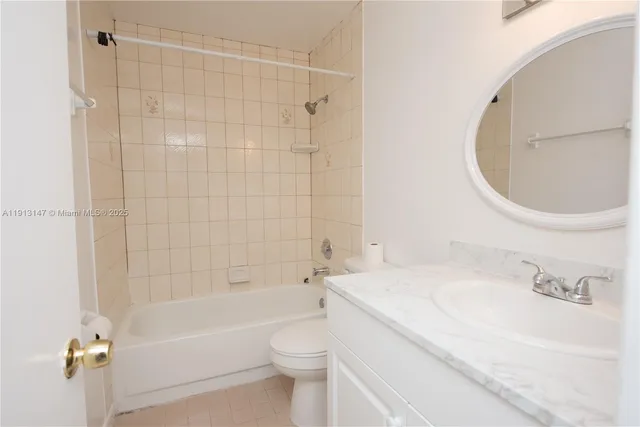 a bathroom with a sink a toilet and a bathtub