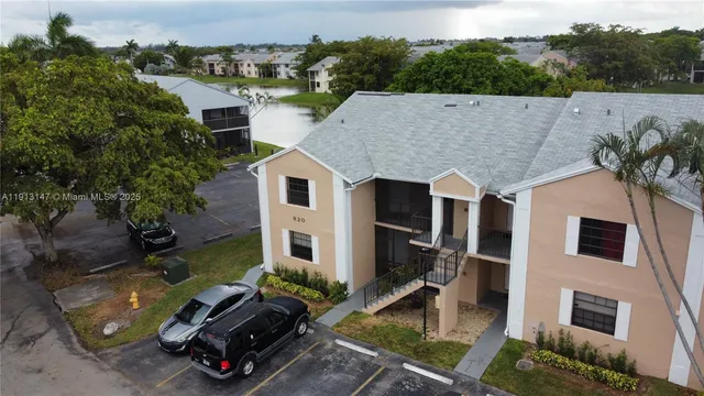 an aerial view of a house with sitting area and furniture