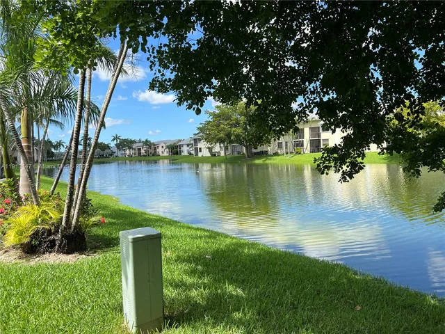 a view of a garden with a lake