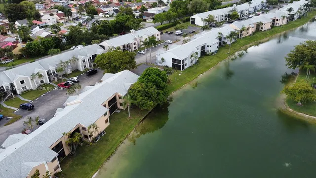 an aerial view of a house with a lake view