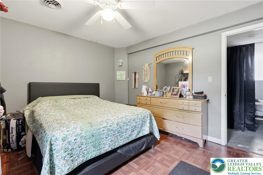 732 Bushkill Center Road Nazareth, PA 18064 - Photo 24 of 43 A comforting bedroom space features hardwood flooring and a ceiling fan for year-round comfort.