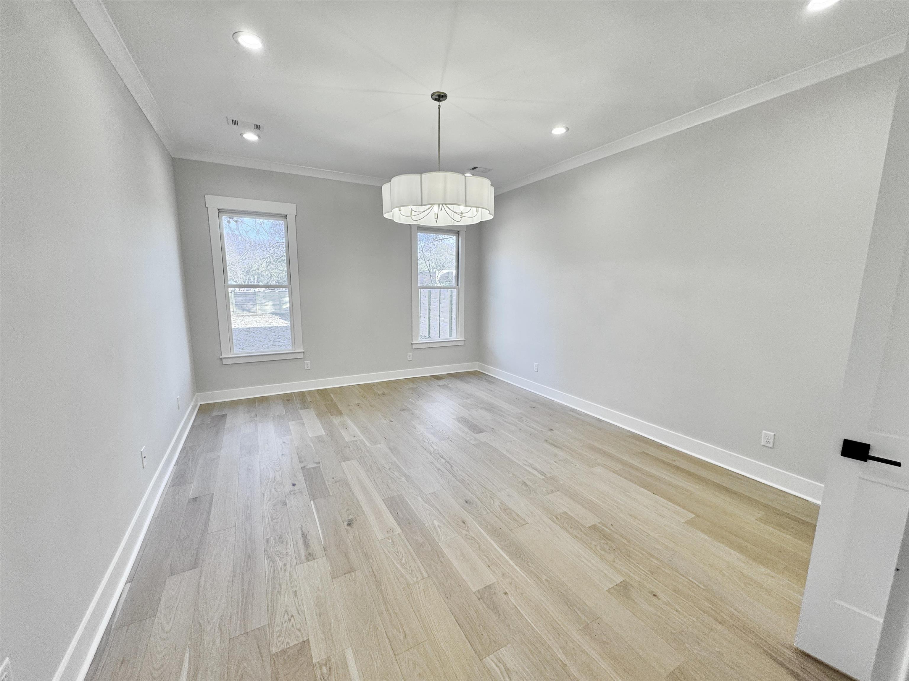 354 Avon Road Memphis, TN 38117 - Photo 18 of 40 Spare room with crown molding, light wood-style flooring, and recessed lighting
