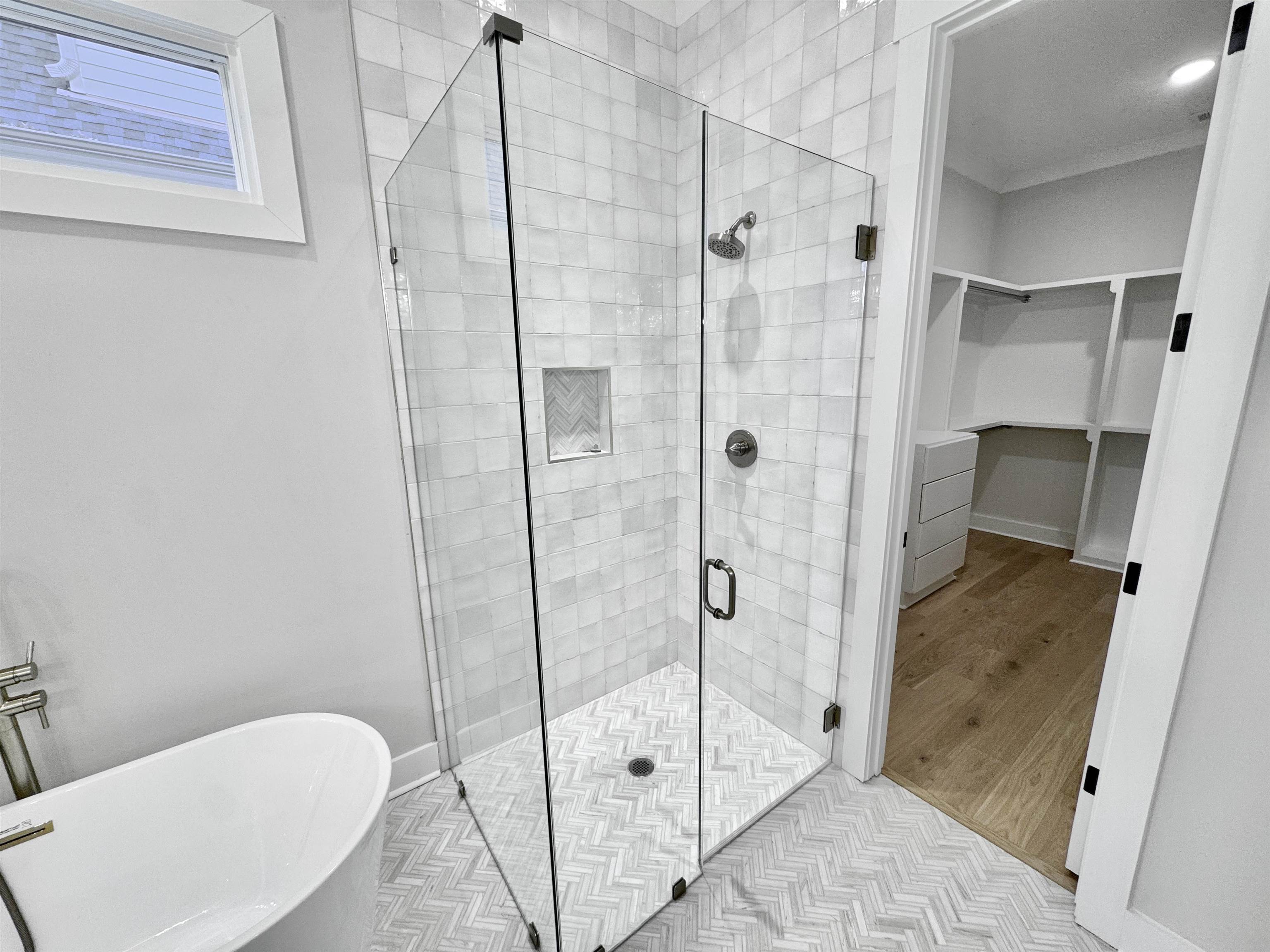 354 Avon Road Memphis, TN 38117 - Photo 23 of 40 Bathroom featuring a stall shower, a soaking tub, and a walk in closet