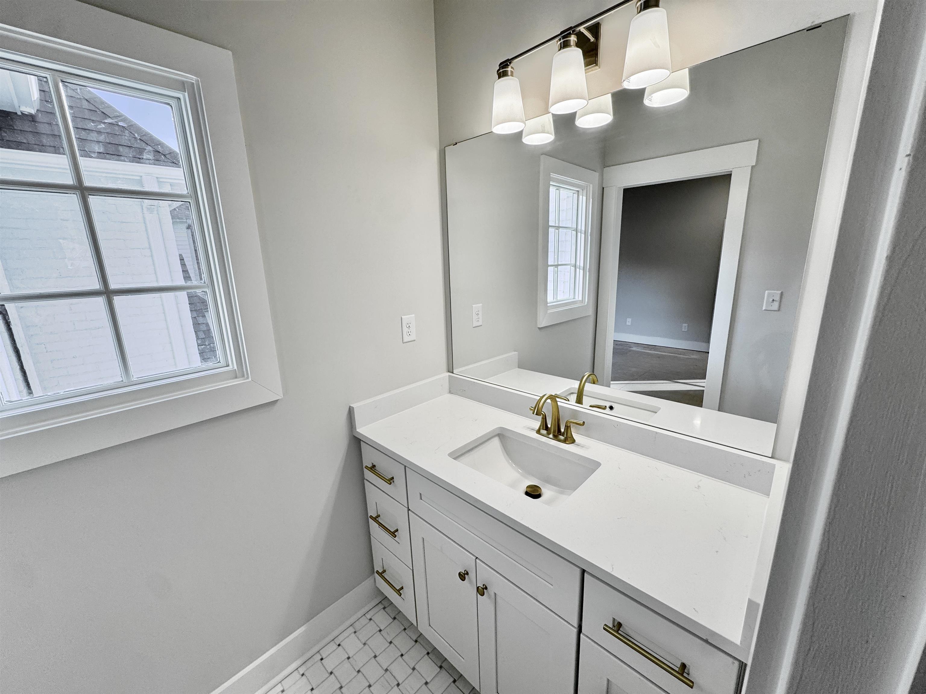 354 Avon Road Memphis, TN 38117 - Photo 29 of 40 Bathroom with vanity and baseboards