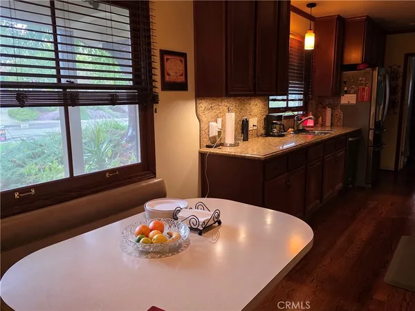 a kitchen with a sink cabinets and a large window