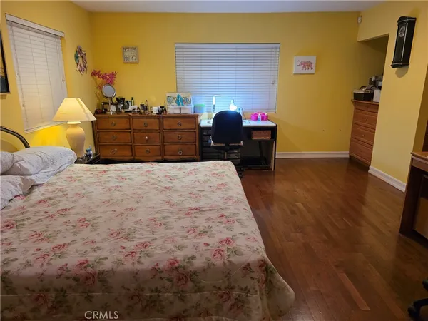 a bedroom with bed and window