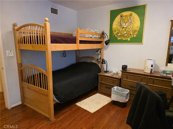 a bedroom with furniture and a window