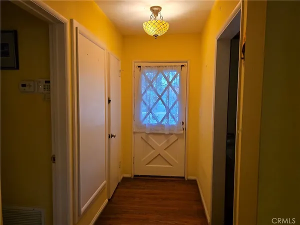 a view of front door with wooden floor