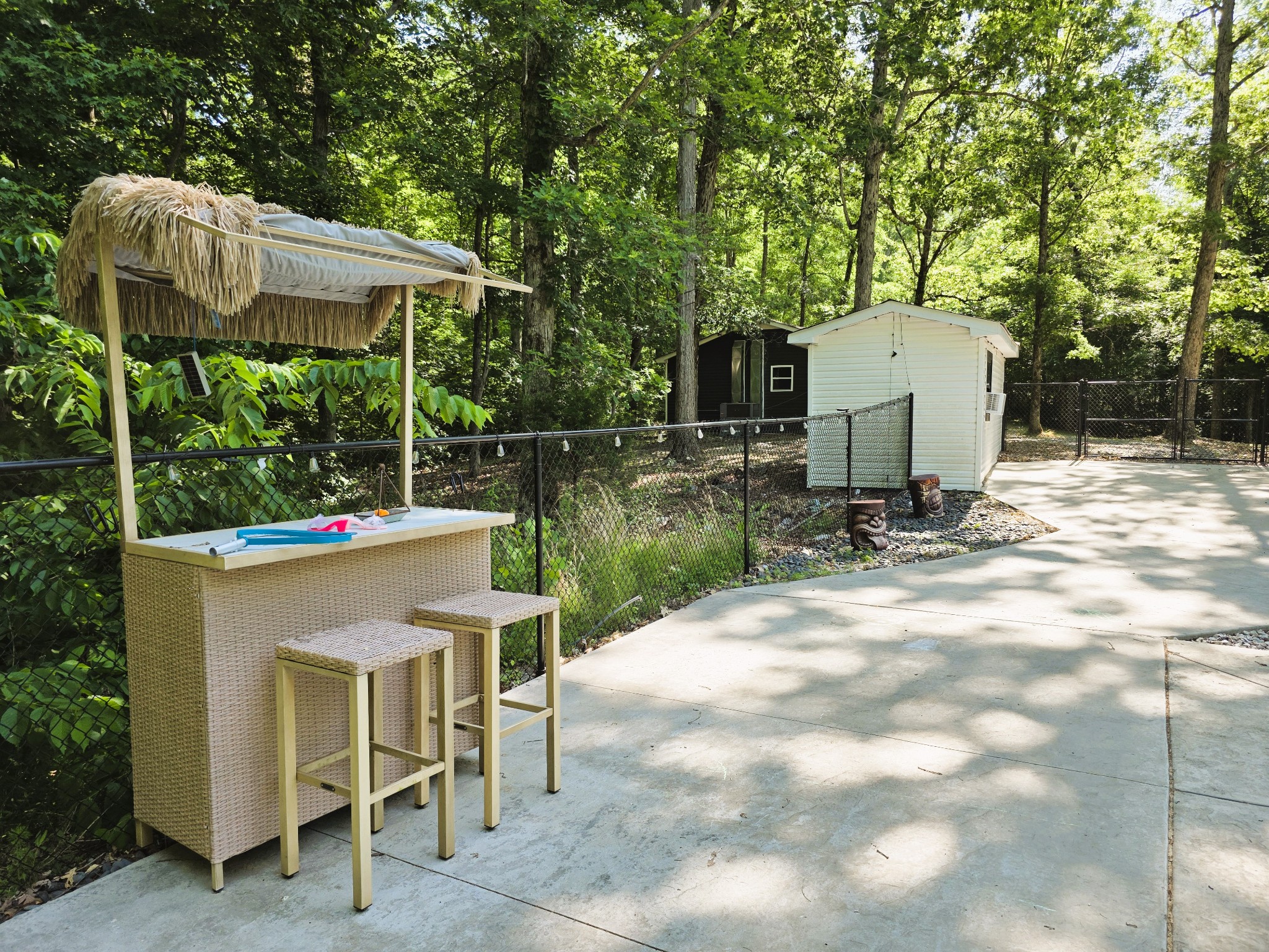 1975 Kelly Road Holladay, TN 38341 - Photo 8 of 95 a view of backyard with table and chairs and a large tree
