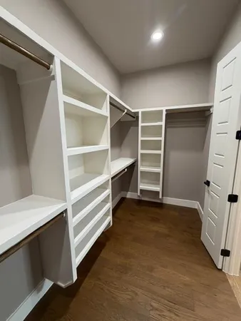 a view of an empty walk in closet